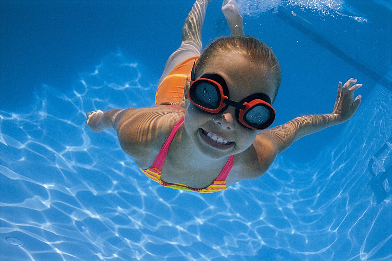 Young girl smiling underwater