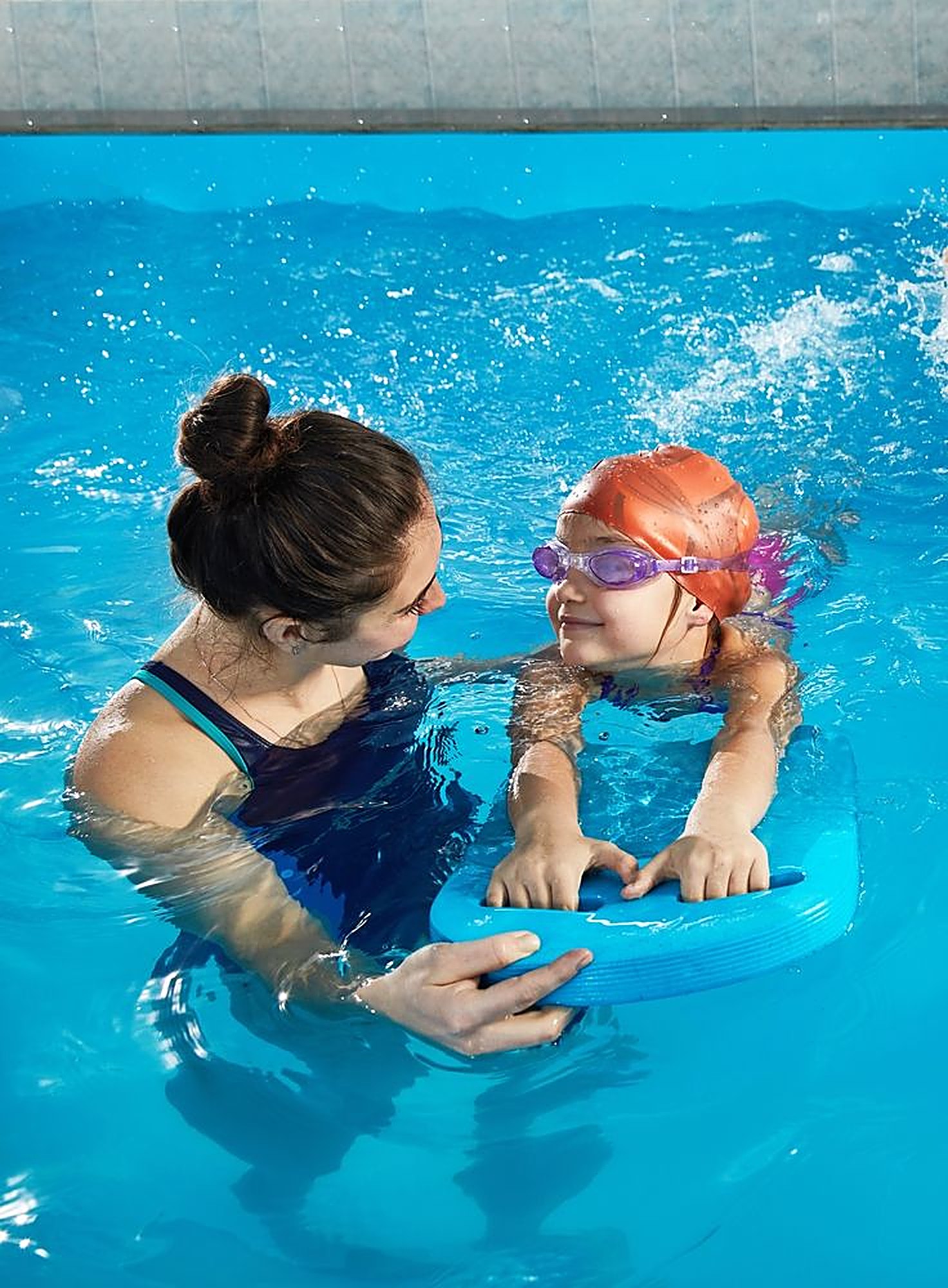 Instructor Maya with a child