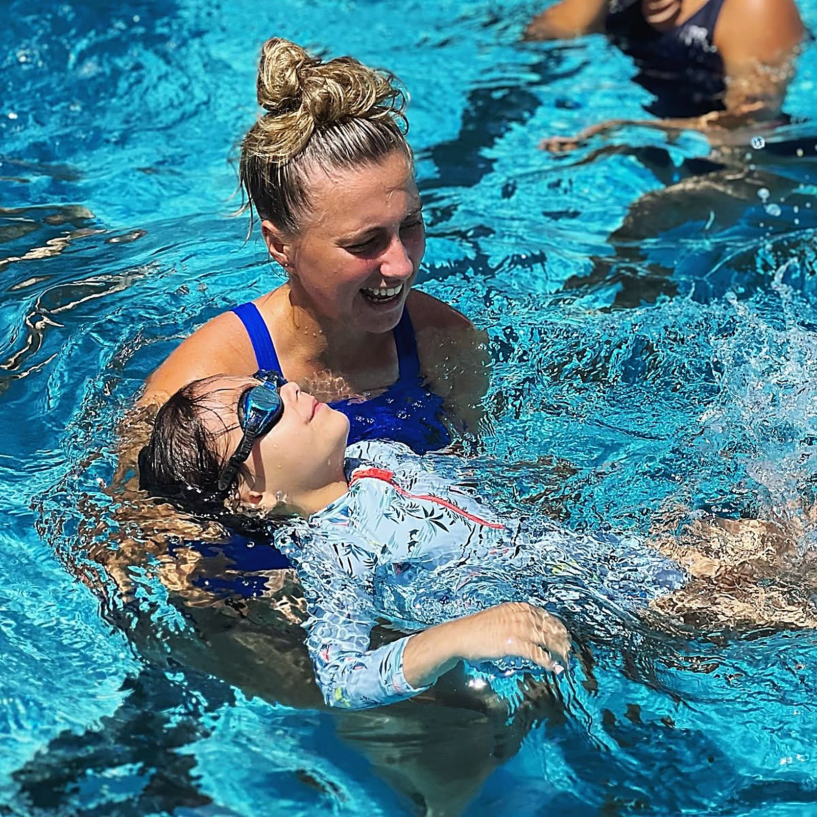 Instructor Sofia with a child